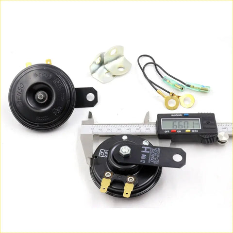 Black denso 12v motorcycle horn with gold terminals and bracket for nissan datsun 120y 140y 160j back side view