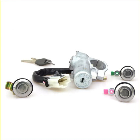 Silver ignition cylinder with black wiring and white connector and matching keys for nissan datsun 720 locks
