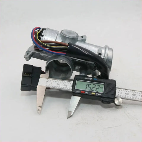 Silver metallic ignition door fuel tank lock actuator with wiring and digital caliper measuring width for toyota hilux rn50 rn60 yn65 yn67 1983-1988