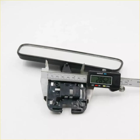 Black plastic interior mirror for Toyota Hilux 1997-2006 with rectangular reflective surface and mounting bracket