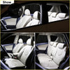 White leather car seats with black trim shown inside a nissan navara featuring led interior light bulb kit