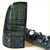 Black smoked led tail light assembly with glossy finish and horizontal lens sections for toyota hilux 2004-2016