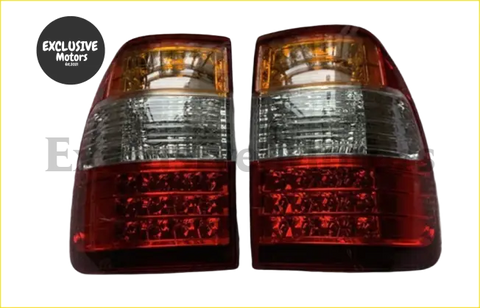 Pair of red and amber led tail lamps with clear lens sections for toyota land cruiser lc100 back side view