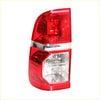 Left tail light for Toyota Hilux SR5 2012-2014 with red and clear plastic lenses and chrome trim front view