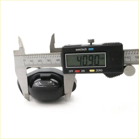 Black rubber caster wheel being measured by digital caliper for license plate light x2 for isuzu rodeo tf/tfr and chevrolet luv