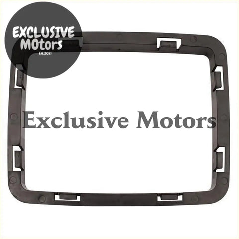 Black plastic dashboard frame with integrated mounting clips shown from back for manual console boot retainer trim Holden Commodore VL