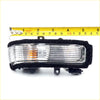 Black-framed mirror cover turn signal lightset for Toyota Hilux 2011-2015 with clear ribbed lens and amber indicator