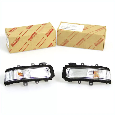 Black-framed toyota hilux mirror cover turn signal lights with clear lenses and amber indicators 2011-2015
