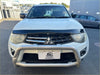 White mitsubishi triton pickup with silver bull bar and black front bumper guard featuring monsoon and bonnet guard
