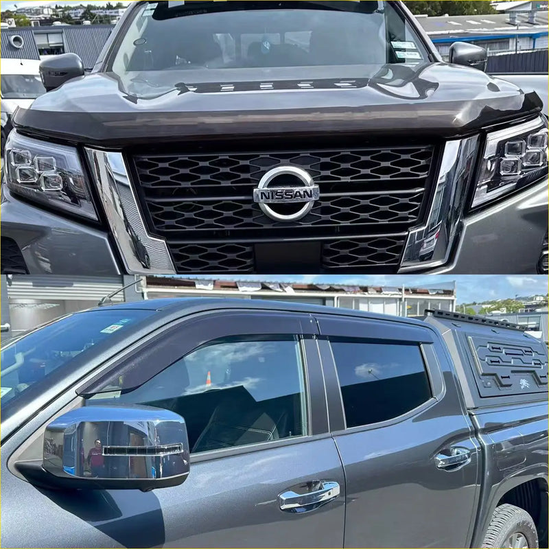 Dark gray nissan navara pickup 2021-2025 with monsoon and bonnet guard chrome accents and roof rack visible from back