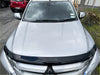 Silver renault duster suv with black front bumper protector and wet hood featuring monsoon bonnet guard for mitsubishi triton 2019-2023