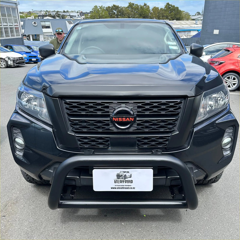 Black nissan navara 2021 pickup with rugged nismo grille featuring chrome accents and tough front bumper