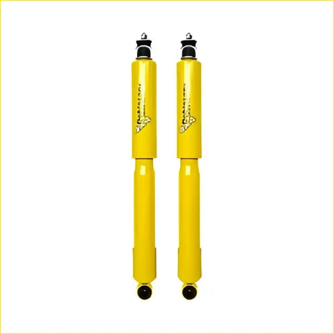 Pair of bright yellow dobinsons twin tube nitro gas shock absorbers with black caps for nissan navara d21 d22