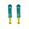 A pair of turquoise and yellow coil-over suspension shocks with black mounts for nissan navara frontier d40