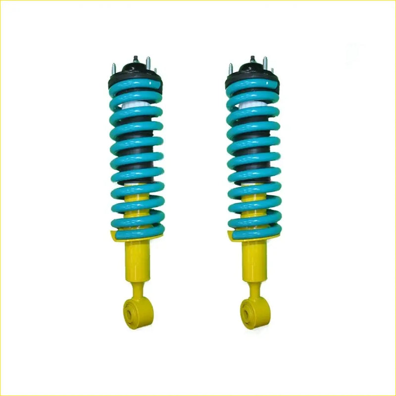 A pair of vibrant turquoise and yellow coil-over suspension shocks with black top mounts for nissan pathfinder r51 ti 550 diesel 3.0l tdi 2010 to 2013