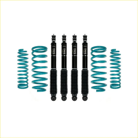 Set of four black Dobinsons ims monotube shock absorbers with teal springs for Nissan Patrol y61 gu wagon 1997 on