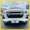 White isuzu d-max 2021-2023 pickup with black nudge bar compatible with front sensors and black grille and bumper