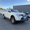 White mitsubishi triton pickup with matte black nudge bar compatible with front sensors from 2005-2015 models