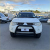 White mitsubishi triton pickup with a matte black nudge bar and roof rack compatible with front sensors 2005-2015