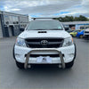 White toyota hilux with a chrome nudge bar compatible with front sensors and black grille for 2005-2015 models