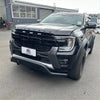 Black ford ranger wildtrak with rugged matte finish and bold grille featuring a nudge bar for ford ranger 2022+