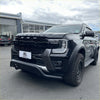 Black ford ranger wildtrak with a rugged matte finish and aggressive front grille featuring a nudge bar for 2022+ models