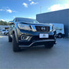 Black nissan navara np300 pickup truck with rugged black nudge bar and chrome accents for 2015-2020 model