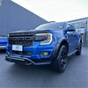 Vibrant blue ford ranger raptor with black accents and off-road tires featuring nudge bar lower style for 2022+ models
