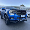 Vibrant blue ford ranger 2022 with black nudge bar lower style and rugged off-road tires front view