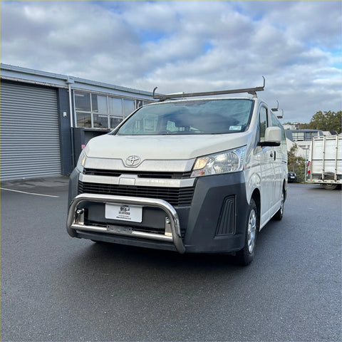 White toyota hiace van with chrome nudge bar and roof rack showing front side for 2019 and newer models
