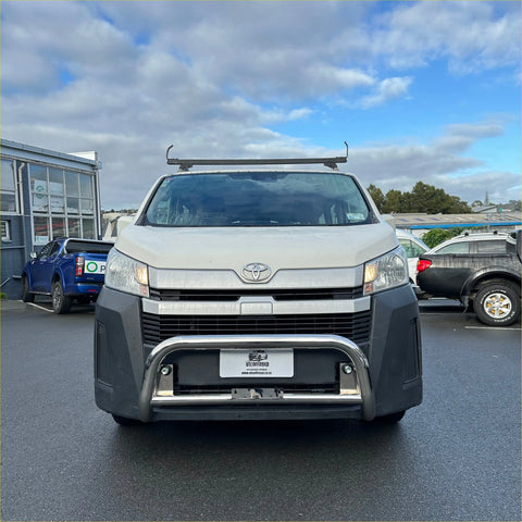 White toyota hiace van with chrome nudge bar and roof rack shown from the front for 2019 and newer models