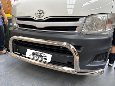 Chrome finished uteoffroad nudge bar front bumper guard mounted on white toyota hiace wide body 2005-2019