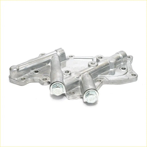 Silver metallic oil cooler cover with two cylindrical output shafts and threaded fittings for nissan atlas engines