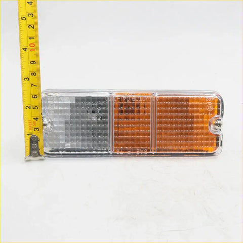 Clear plastic rectangular parking turn light with gray amber and black sections for mazda b2000 1978 1985