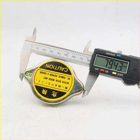 Yellow and black metallic radiator cap for Toyota Hilux LN40 LN46 RN30 RN36 1978-1983 with multilingual warnings