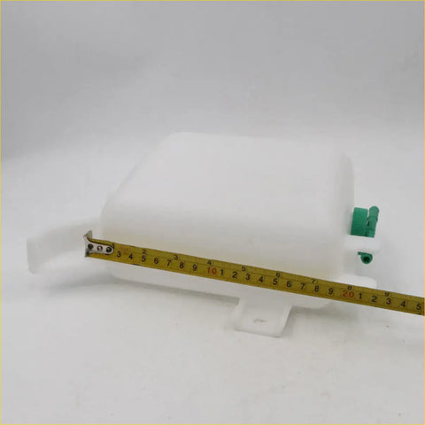 White plastic radiator overflow tank with green caps and mounting bracket for Nissan Datsun D21 Navara 1986-1997