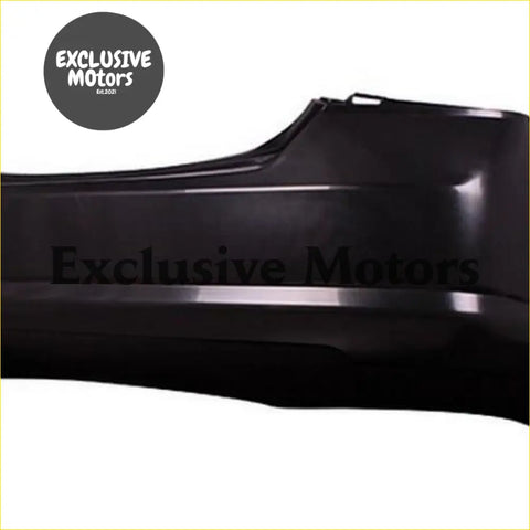 Black plastic rear bumper for nissan tiida sedan 2005-2006 with exclusive motors embossed in matte finish backside view