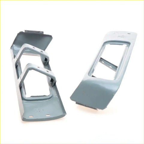 Gray plastic rear bumper holder tail lights trim pieces with molded contours and mounting holes for nissan datsun 620