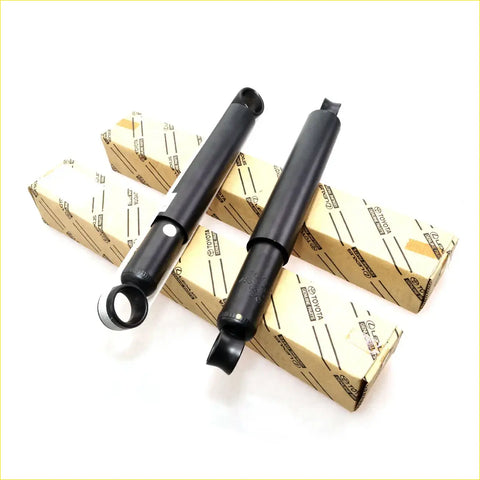 Rear shock absorber for Toyota Hilux double cab 2001-2004 in black with chrome accents and branded packaging