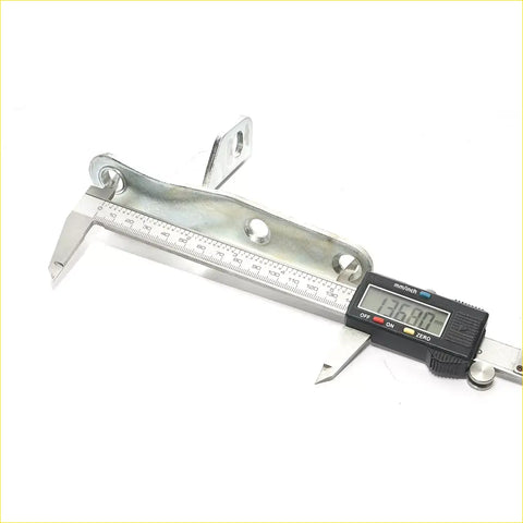 Digital caliper with black body and silver metal jaws showing mm and inch for rear tail gate hinge toyota hilux revo