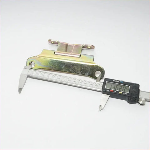 Rear tail gate hinge for Toyota Hilux 2004-2015 with yellowish-green patina and two mounting holes back side view