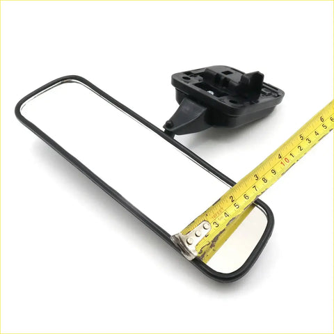 Black-framed rectangular rear view mirror with black plastic mount for Toyota Hilux 1988-1997 shown from back side