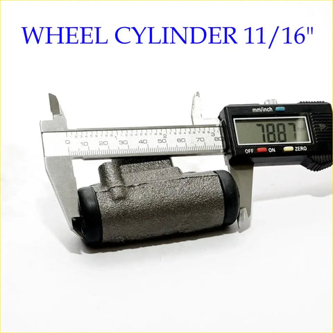 Rear wheel brake cylinder for mazda bongo e-series in gray metal with black rubber boots measured at 11/16 inches