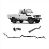 White Toyota Land Cruiser pickup with black trim and rugged tires featuring redback extreme duty exhaust on leaf springs