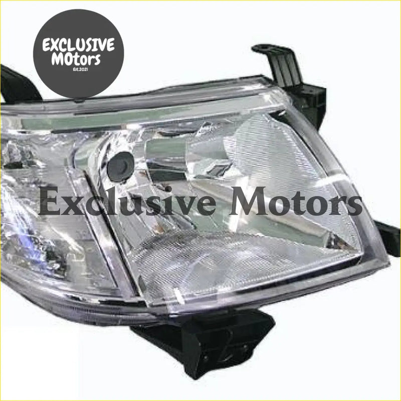 Right hand clear plastic headlight for toyota hilux 2011-2015 with black mounting brackets visible