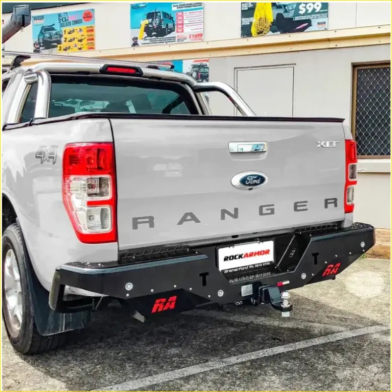 Silver ford ranger ute with black rockarmor steel rear step towbar and red branding for offroad 4wd use