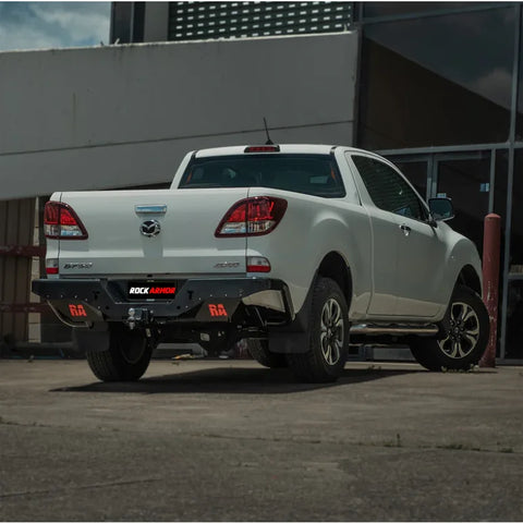White Mazda BT-50 pickup truck showing the back side with rockamor elite steel rear step and towbar installation