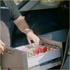 Silver-framed rockarmor 31 litre vehicle draw fridge with digital display and sliding drawer full of soda cans for 4wd ute offroad use