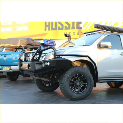 Silver isuzu mux ute with rockarmor elite hoop bullbar black bumper guard and rugged offroad 4wd tires