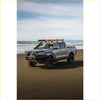 Silver toyota hilux 4wd ute with rockarmor gt hoop bullbar combo pack and roof rack for offroad adventures